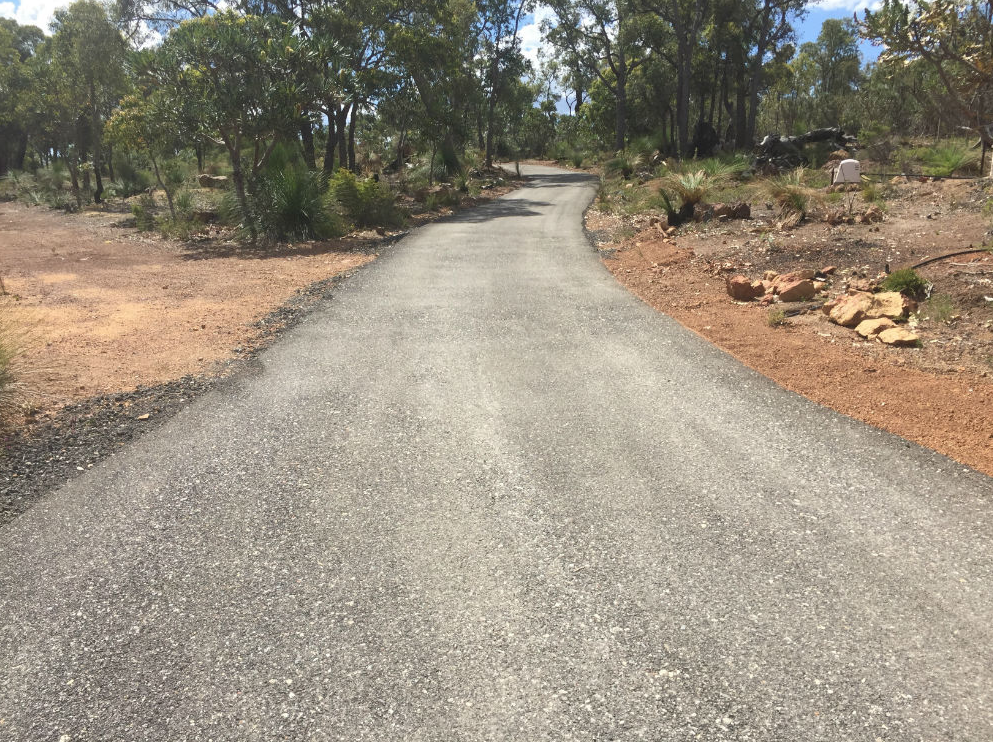 This is a photo of a hot spray & seal bitumen driveway which is in the process of being installed by Clifton Asphalt & Bitumen Surfacing