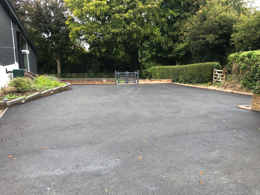 This is a photo of a bitumen driveway which is in the process of being installed by Clifton Asphalt & Bitumen Surfacing