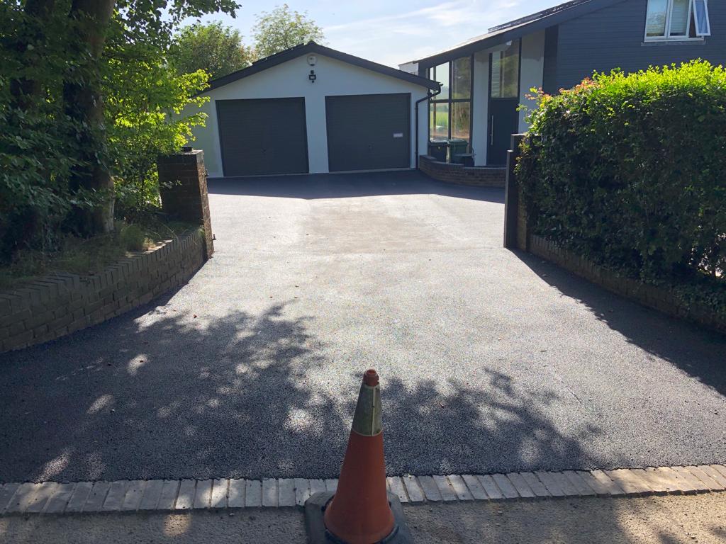 This is a photo of a bitumen driveway which is in the process of being installed by Clifton Asphalt & Bitumen Surfacing 5